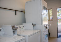 The laundry area is located in the front bath house.